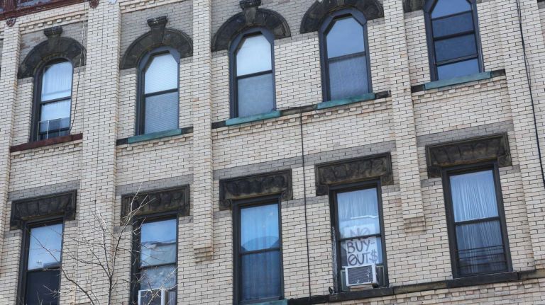 A sign in the window of an apartment on Starr street between Central and Knickerbockerin. 