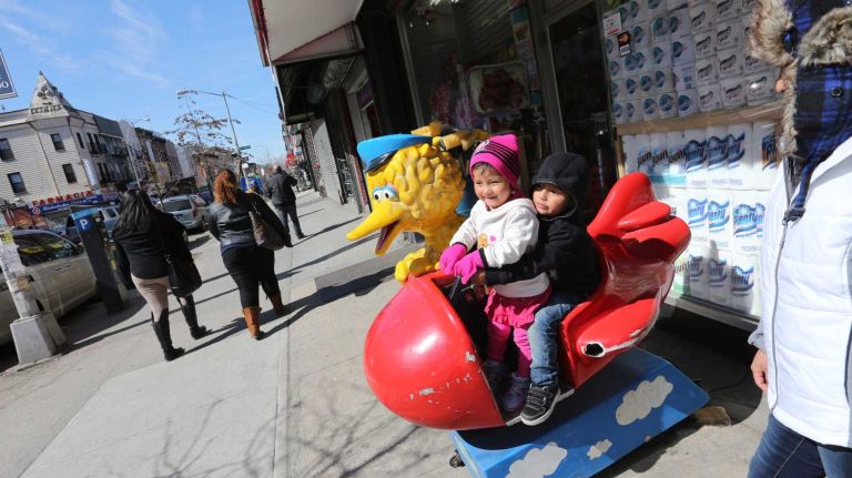 Cecilia Chango, far right, with her children, Amy, 2, and Eric, 4 outside the Dollar store at 373 Knickerbocker St. in Bushwick. 