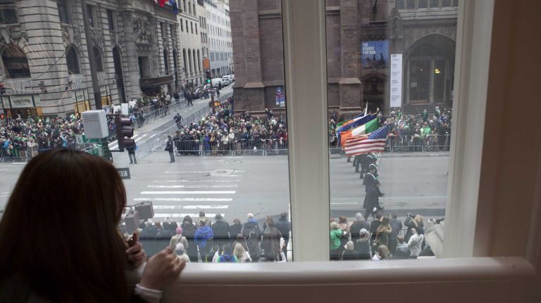 Fans watch as participants march during the 245th Annual Saint Patrick's Day Parade along Fifth Avenue in Manhattan on Tuesday, March 17, 2015.