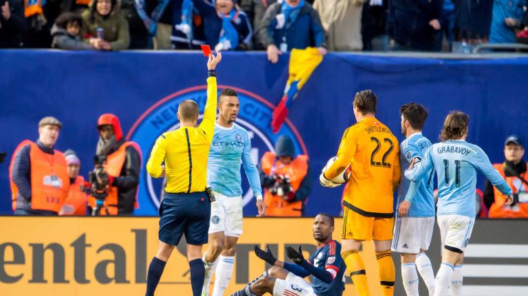 New England Revolution defender Jose Goncalves (23) is shown a red card after tackling New York City FC forward Khiry Shelton (19) during a game at Yankee Stadium on Sunday, March 15, 2015.