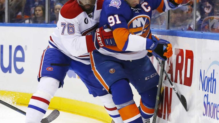 John Tavares of the New York Islanders battles for the puck during the first period against P.K. Subban of the Montreal Canadiens at Nassau Coliseum on Saturday, March 14, 2015.