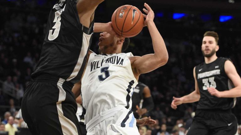 Villanova Wildcats guard Josh Hart loses the ball against Providence Friars guard Kris Dunn in a Big East semifinal men's basketball game at Madison Square Garden on Friday, March 13, 2015.