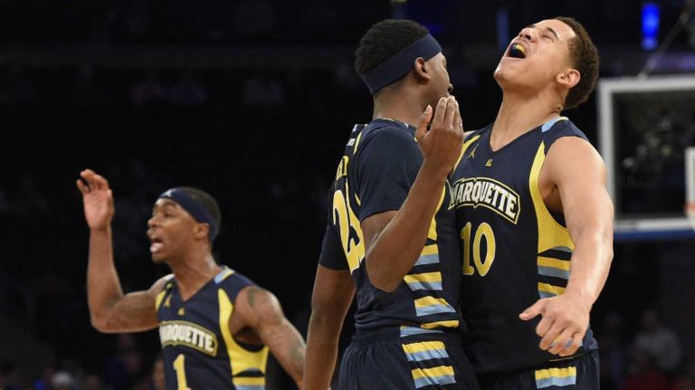 Marquette Golden Eagles forward Juan Anderson, right, chest bups Marquette Golden Eagles guard JaJuan Johnson against the Seton Hall Pirates in the first round of the Big East basketball tournament at Madison Square Garden on Wednesday, March 11, 2015.