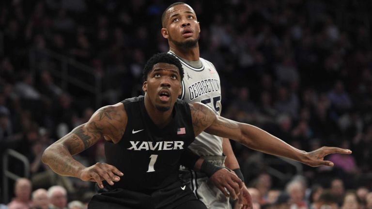 Big East Tournament semifinal: Georgetown vs. Xavier 44 Xavier Musketeers forward Jalen Reynolds looks for a rebound against Georgetown Hoyas guard Jabril Trawick in a Big East semifinal men's basketball game at Madison Square Garden on Friday, March 13, 2015.