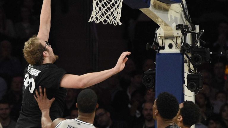 Big East Tournament semifinal: Georgetown vs. Xavier 46 Xavier Musketeers center Matt Stainbrook tips in a basket against the Georgetown Hoyas in a Big East semifinal men's basketball game at Madison Square Garden on Friday, March 13, 2015.