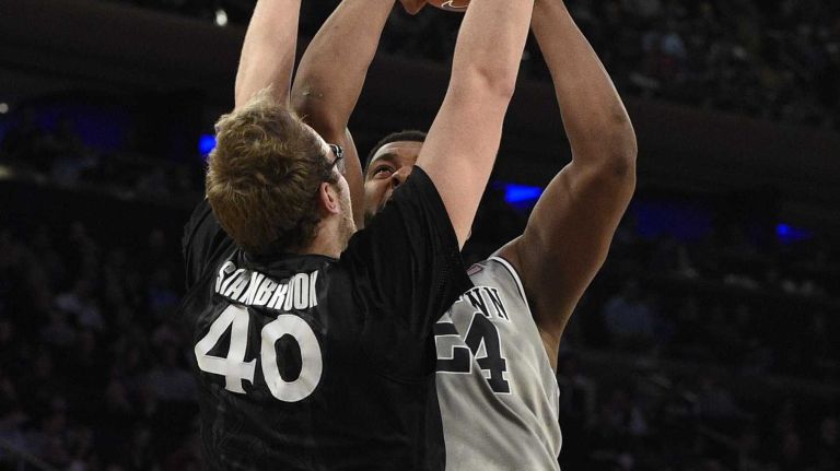 Big East Tournament semifinal: Georgetown vs. Xavier 51 Georgetown Hoyas center Joshua Smith is fouled by Xavier Musketeers center Matt Stainbrook in a Big East semifinal men's basketball game at Madison Square Garden on Friday, March 13, 2015.