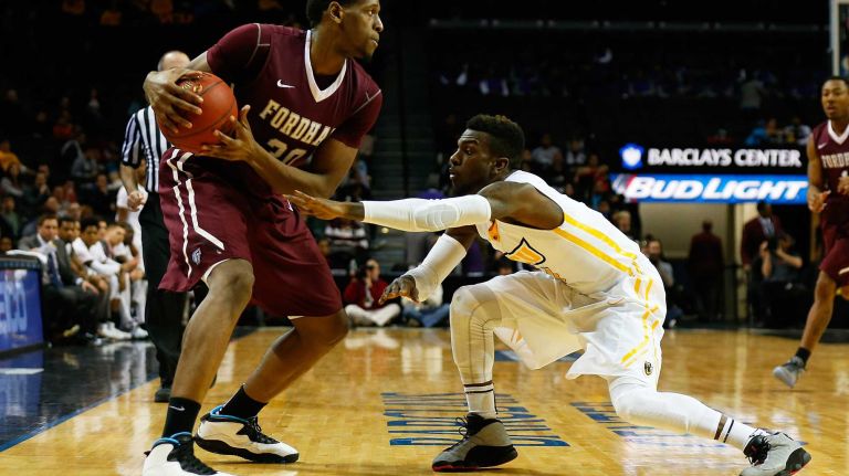 NEW YORK, NY - MARCH 12: JeQuan Lewis #1 of the Virginia Commonwealth Rams defends against Ryan Rhoomes #30 of the Fordham Rams during the Second Round of the Atlantic 10 Basketball Tournament at Barclays Center on March 12, 2015 in New York, New York. (Photo by Mike Stobe/Getty Images)