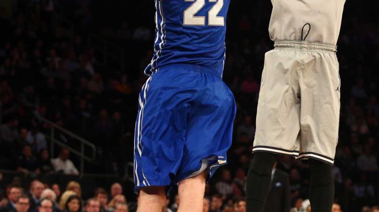 Georgetown Hoyas guard Jabril Trawick shoots over Creighton Bluejays guard Avery Dingman during the first half of a Big East Tournament game at Madison Square Garden on Thursday, March 12, 2015.