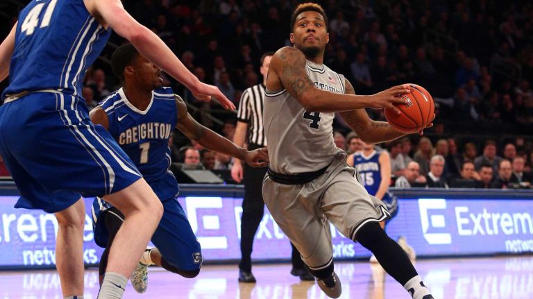 Georgetown Hoyas guard D'Vauntes Smith-Rivera #4 drives against Creighton Bluejays center Geoffrey Groselle #41 during the first half of a Big East Tournament game at Madison Square Garden on Thursday, Mar 12, 2015.
