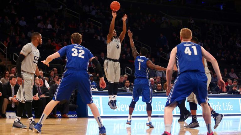 Georgetown Hoyas guard D'Vauntes Smith-Rivera shoots over Creighton Bluejays guard Austin Chatman during the first half of a Big East Tournament game at Madison Square Garden on Thursday, March 12, 2015.