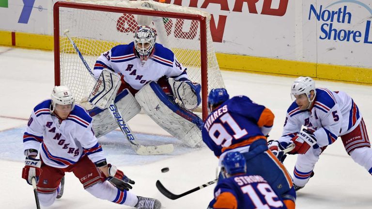 New York Islanders' John Tavares takes a shot against New York Rangers goalie Cam Talbot in the third period at Nassau Coliseum on Tuesday, March 10, 2015.