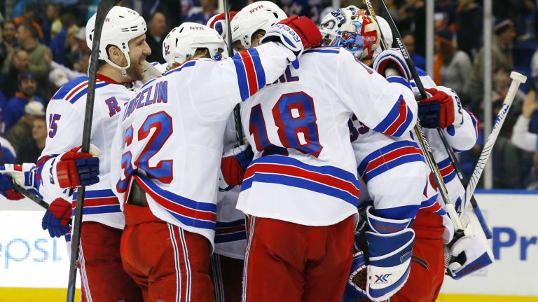 The New York Rangers celebrate after defeating the New York Islanders at Nassau Coliseum on Tuesday, March 10, 2015.