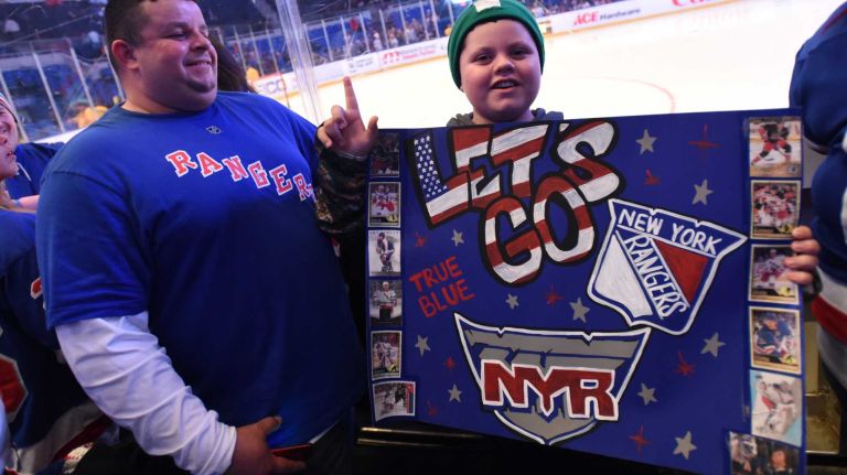 Fans at Islanders vs. Rangers 29 Rangers fans Ruben and RJ Fournier show their team pride at Nassau Coliseum during the last Islanders-Rangers regular-season game at the Coliseum on March 10, 2015.