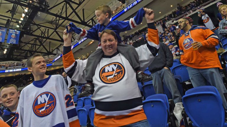 Fans at Islanders vs. Rangers 31 Islanders fan Jim Moehringer carries his seven-year-old nephew, Rangesr fan Patrick Sexton, on his shoulders at Nassau Coliseum during the last Islanders-Rangers regular-season game at the Coliseum on March 10, 2015.