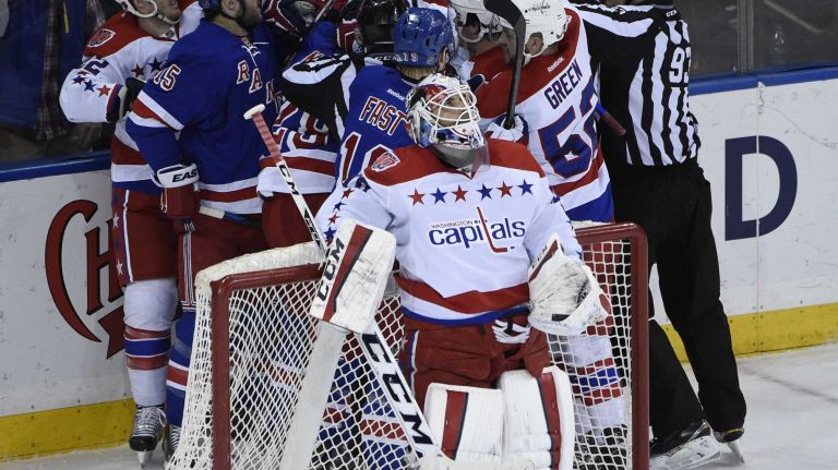 Rangers vs. Capitals 37 The New York Rangers and the Washington Capitals mix it up behind Washington Capitals goalie Braden Holtby in the second period of an NHL hockey game at Madison Square Garden on Sunday, March 29, 2015.