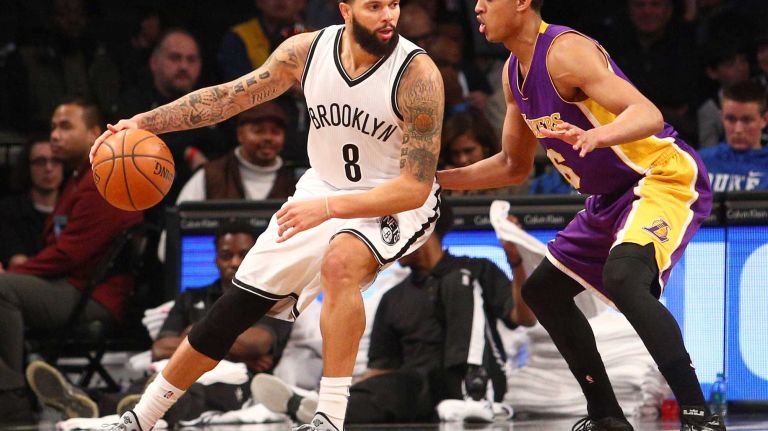 Brooklyn Nets point guard Deron Williams controls the ball against Los Angeles Lakers point guard Jordan Clarkson during the third quarter at Barclays Center on Sunday, March 29, 2015.