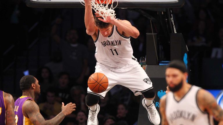 Brooklyn Nets center Brook Lopez dunks over Los Angeles Lakers power forward Tarik Black during the fourth quarter at Barclays Center on Sunday, March 29, 2015.