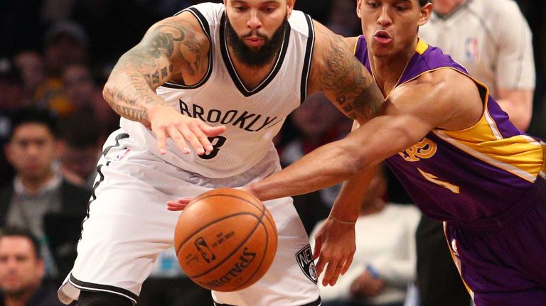 Brooklyn Nets point guard Deron Williams is fouled by Los Angeles Lakers point guard Jordan Clarkson during the fourth quarter at Barclays Center on Sunday, March 29, 2015.
