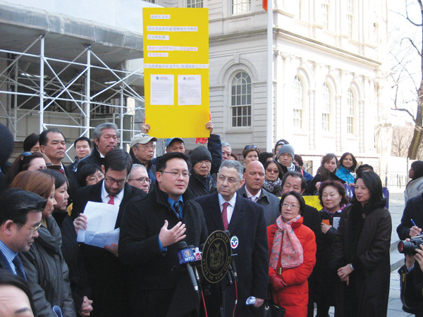 Assemblymember Ron Kim spoke about making the Lunar New Year a school holiday at City Hall, as Assemblymember Sheldon Silver and Councilmember Margaret Chin looked on and state Senator Dan Squadron glanced at a group’s press release. Photo by Dusica Sue Malesevic