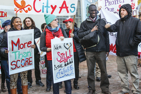 City As School students and staff held a press conference in front of the Clarkson St. school, then marched up to Washington Square for a rally.  Photo by Zach Williams