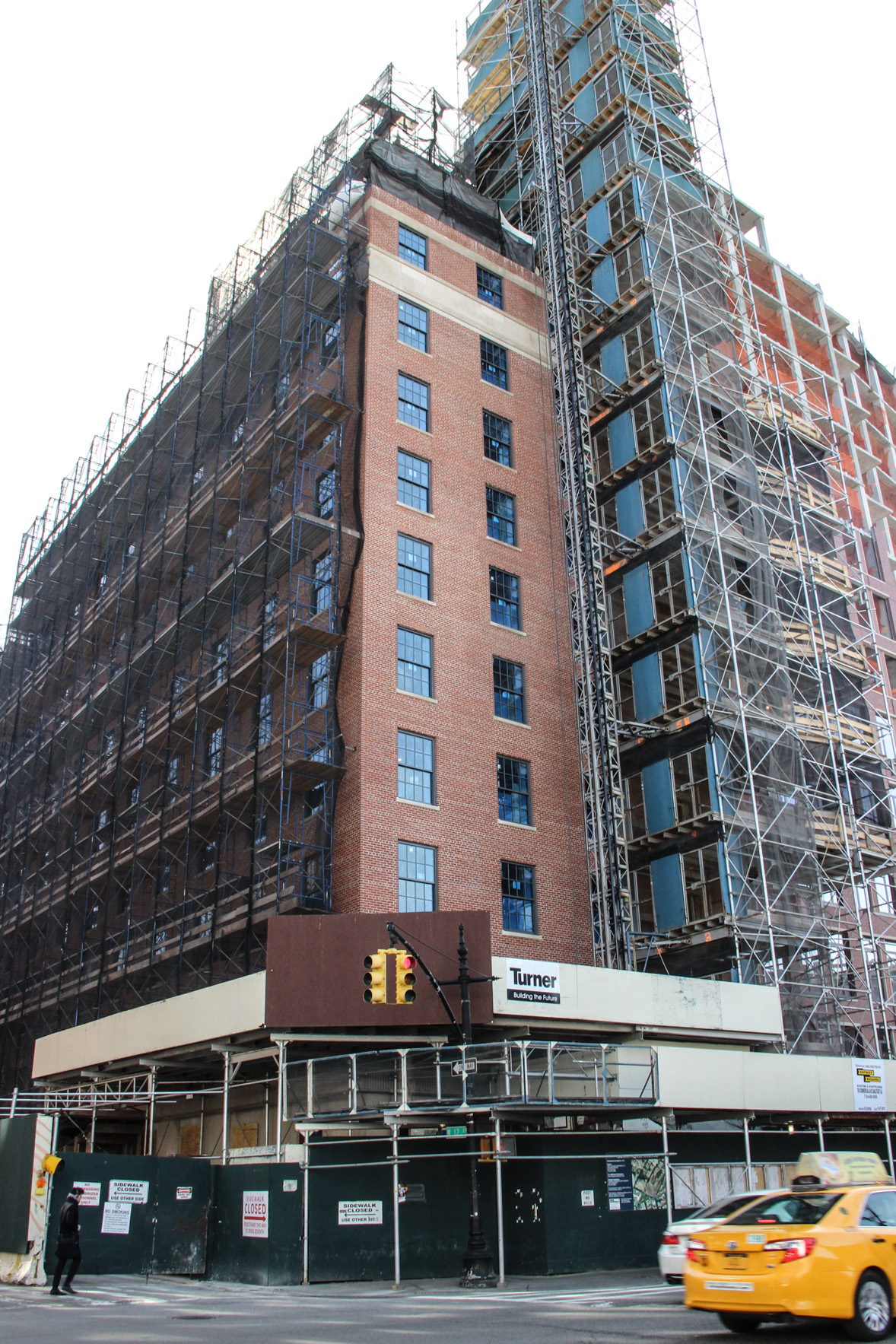 It was near this corner at W. 12th St. and Seventh Ave. that a piece of construction fence blew loose and fatally struck Nguyen. Rudin is converting the former hospital site into high-end residences.   Photo by Tequila Minsky