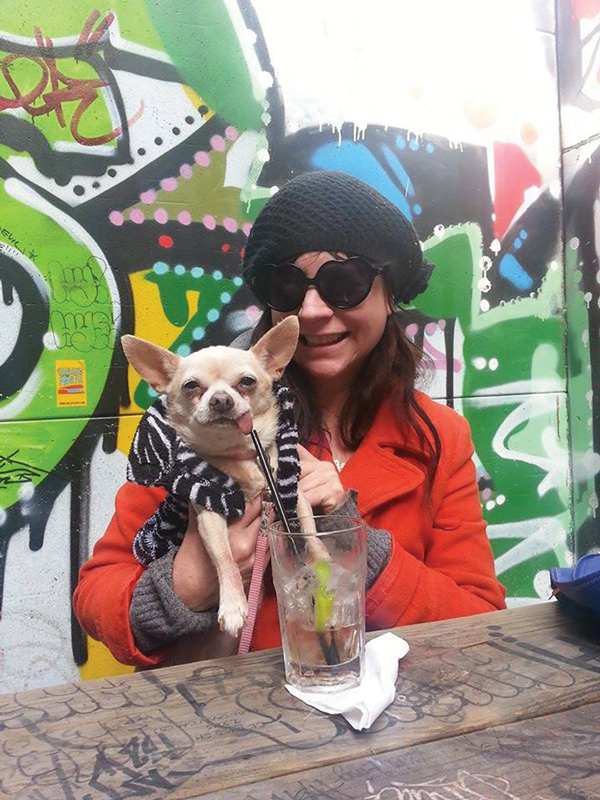 Rev. Jen and Rev. Jen Junior at Double Down Saloon (“where you can hang with your dog, smoke and drink or simply bask in the sunshine before the world melts.”).   Photo by Joe Heaps Nelson
