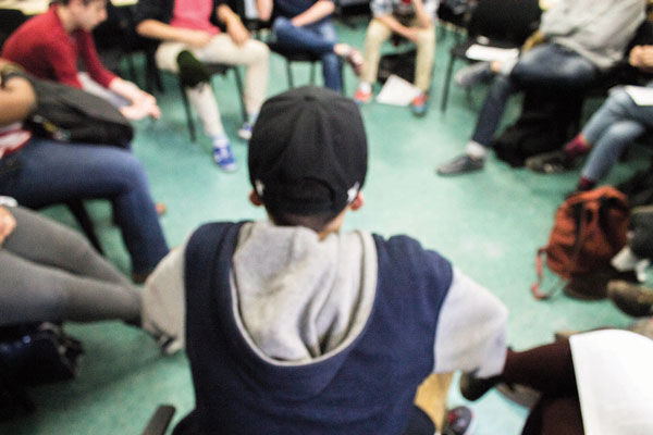 At a teach-in last month, B.H.S.E.C. students participated in a “Rap Music and Politics” discussion session on March 18. Because signed release forms weren’t obtained for all the students — which are required by the Department of Education for photos on school grounds — their faces aren’t shown in this photo.  Photo by Zach Williams