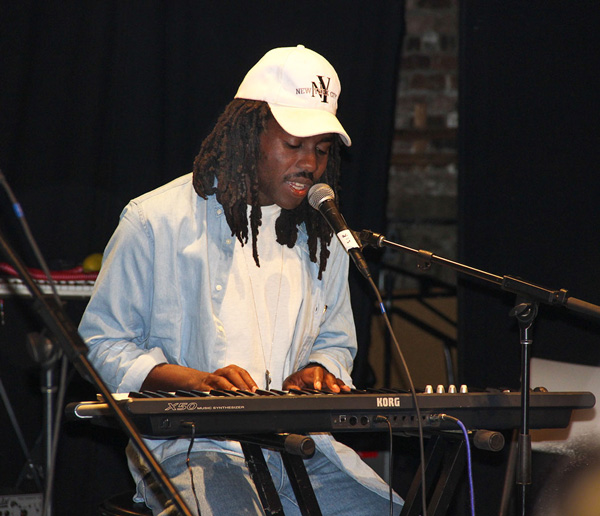 Dev Hynes sang solo with an electronic keyboard.