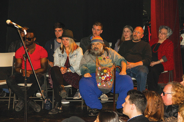 Survivors of the Second Ave. disaster were seated onstage along with the Yippie Pie Man, front row right. 