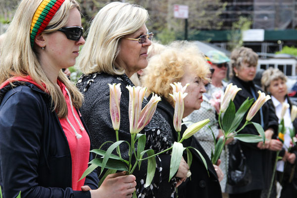 Congregants held lilies as they offered testimony about the significance of the Church of Our Lady of Vilnius to them.