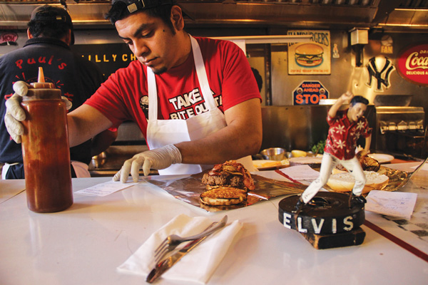 Biz crawl helps shell-shocked shops get cooking 1 Cook Diego Rivera was cooking up “a hunk, a hunk of” flaming burgers.