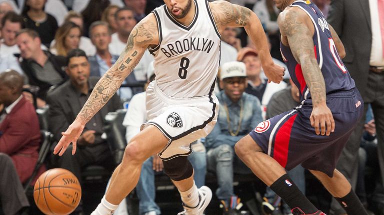 The Brooklyn Nets' Deron Williams drives to the basket against Jeff Teague of the Atlanta Hawks in the fourth quarter of Game 4 of the first round of the NBA playoffs at the Barclays Center on Monday, April 27, 2015.