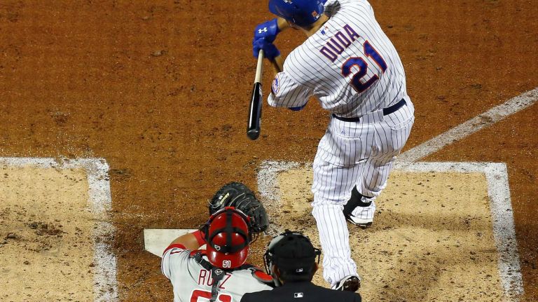 Lucas Duda #21 of the New York Mets connects on a three run double in the second inning against the Philadelphia Phillies at Citi Field on Tuesday, Apr. 14, 2015 in the Queens Borough of New York City.