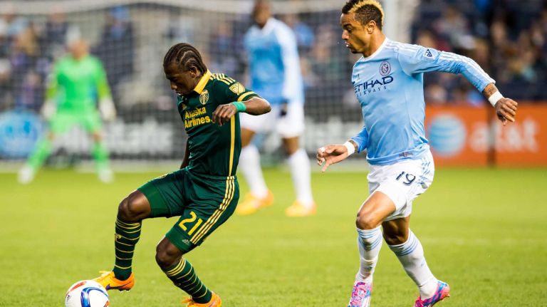 Portland Timbers midfielder Diego Chara (21) is pursued by New York City FC forward Khiry Shelton (19) in a game at Yankee Stadium on Sunday, April 19, 2015.