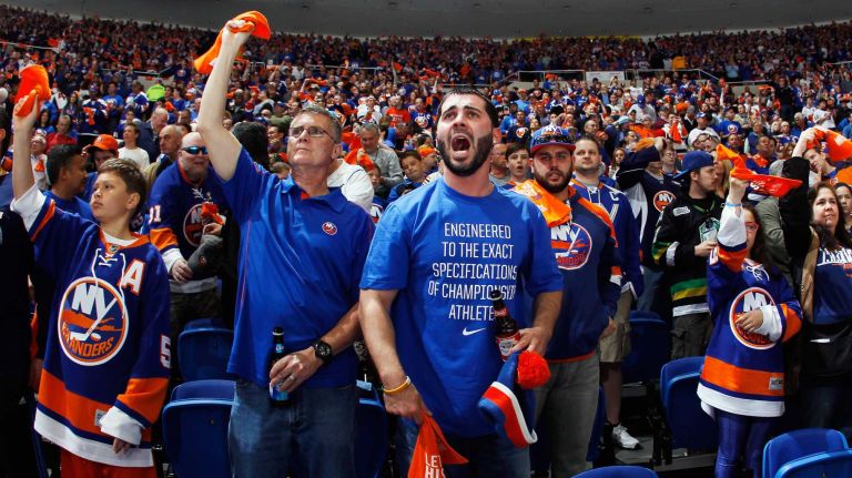 Fans enjoy the atmosphere during Game 3 of the Eastern Conference quarterfinals between the New York Islanders and the Washington Capitals in the 2015 NHL Stanley Cup playoffs at the Nassau Veterans Memorial Coliseum on April 19, 2015.