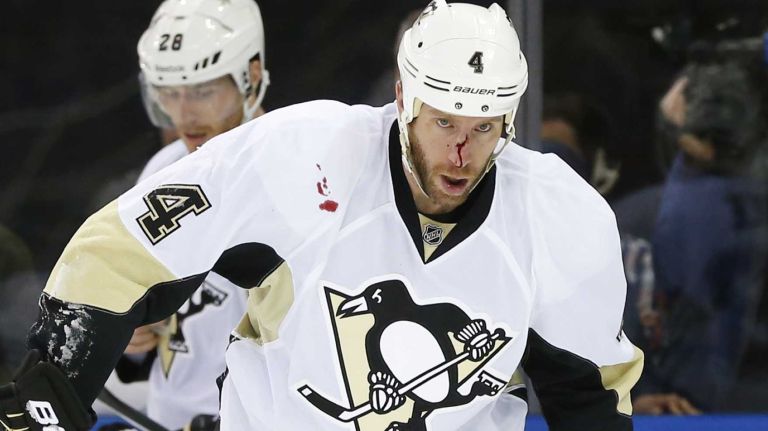 Long Island native Rob Scuderi of the Pittsburgh Penguins looks on after suffering a cut to his face during Game 1 of the Eastern Conference Quarterfinals against the Rangers at Madison Square Garden on April 16, 2015.
