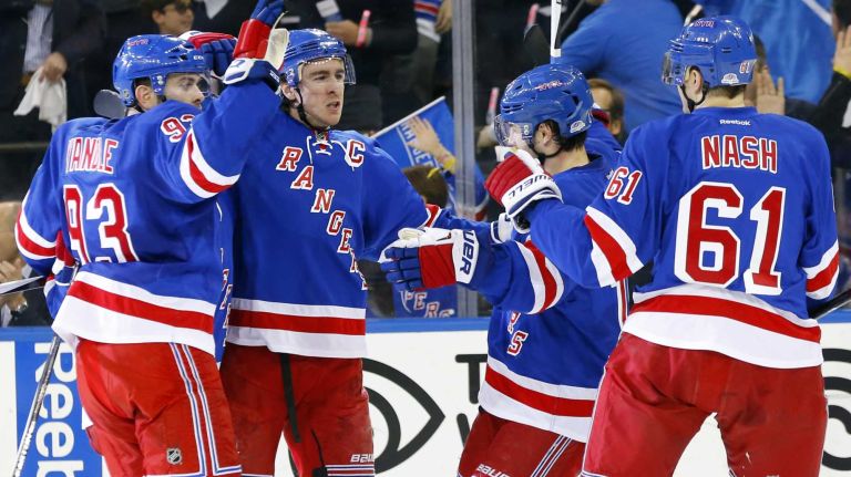 Ryan McDonagh of the New York Rangers celebrates his first-period goal against the Pittsburgh Penguins with teammates during Game 1 of the Eastern Conference Quarterfinals at Madison Square Garden on Thursday, April 16, 2015.