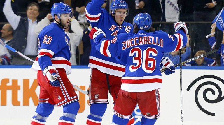 Ryan McDonagh #27 of the New York Rangers celebrates his first-period goal against the Pittsburgh Penguins during Game 1 of the Eastern Conference quarterfinals with teammates Keith Yandle #93 and Mats Zuccarello #36 at Madison Square Garden on Thursday, April 16, 2015.