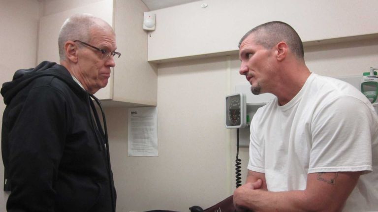 Project Renewal Nurse Practitioner and PhD Bill LaRock discusses health care issues with Sean Mullen, 46, who is recovering from heroin addiction and has HepatitisC. Mullen came in worried about his liver enzymes, which were slightly elevated, but LaRock also took the opportunity to discuss the importance of Mullen quitting cigarettes. Quitting, Mullen finally acknowledged, 