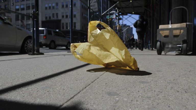 A plastic bag blows along Chambers Street, Wednesday, March 26, 2014. 