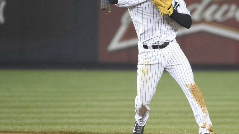 Didi Gregorius 19 Yankees shortstop Didi Gregorius throws to first base during a game against the Toronto Blue Jays at Yankee Stadium on April 9, 2015.