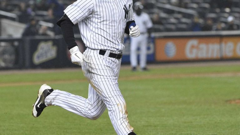New York Yankees center fielder Jacoby Ellsbury reacts as he grounds out to end the baseball game against the Toronto Blue Jays at Yankee Stadium on Thursday, April 9, 2015. The Blue Jays defeated the Yankees 6-3.