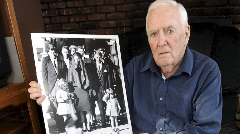 Former New York Daily News photographer Dan Farrell, of Oceanside, has died. In this file photo, Farrell holds the photo he shot of the famous salute of John Kennedy Jr. during the funeral of JFK in November 1963.