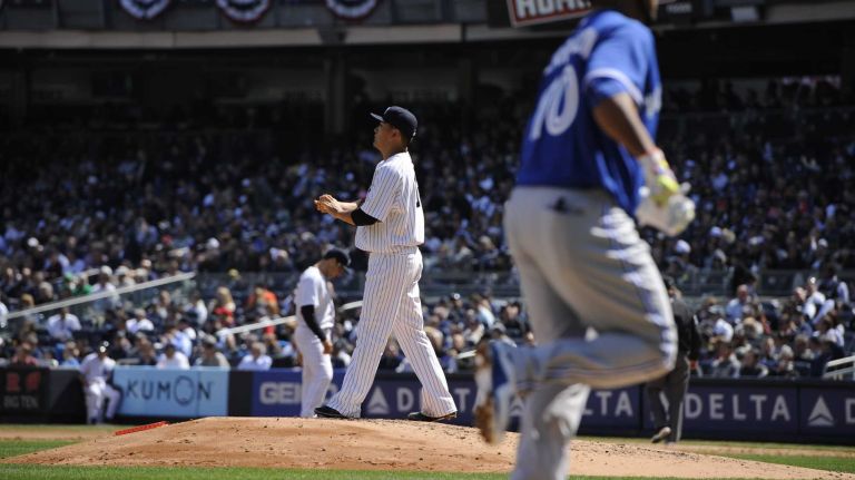 Yankees Opening Day in 2015 41 New York Yankees starting pitcher Masahiro Tanaka reacts on the mound as Toronto Blue Jays first baseman Edwin Encarnacion runs home on his two-run home run in a baseball game on Opening Day at Yankee Stadium on Monday, April 6, 2015.