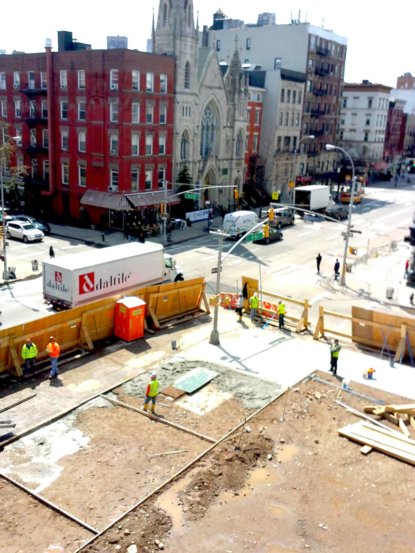 The writer’s apartment is still off limits due to heavy water damage sustained during the fire. This is what she can now see from one of its windows — an empty space where three residential buildings used to stand.  Photo by Yvonne Collery