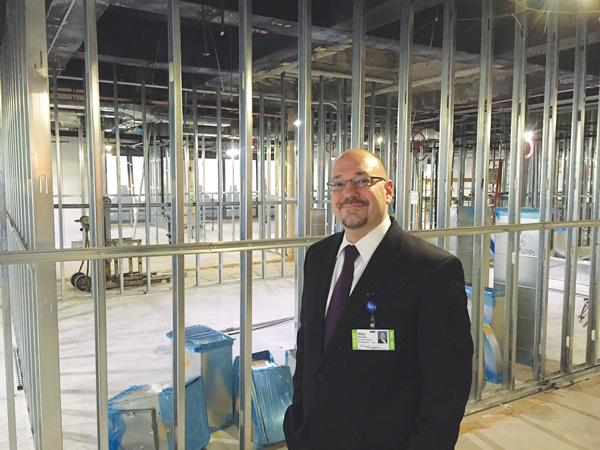 Alex Hellinger on a floor in the HealthPlex being built out to house additional health services.