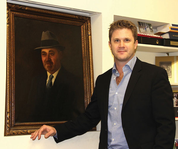 Aaron Gross with a portrait of great-great-grandpa Aron, Streit’s founder.  Photos by Tequila Minsky