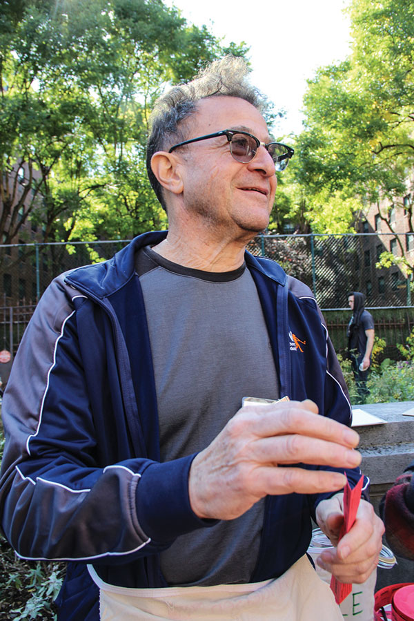 Tobi Bergman, at the Elizabeth St. Garden’s Harvest Fest last year, has been a staunch advocate for preserving the garden as permanent open space, and an opponent of a plan by the city and Councilmember Margaret Chin to build affordable housing on it.    FILE PHOTO