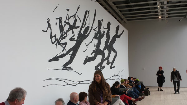 On Sunday, museum members seemed to like sitting on the couches on the fifth floor’s west end, which face floor-to-ceiling windows, currently offering a view of, well...the garbage trucks on Gansevoort Peninsula.   Photos by Lincoln Anderson