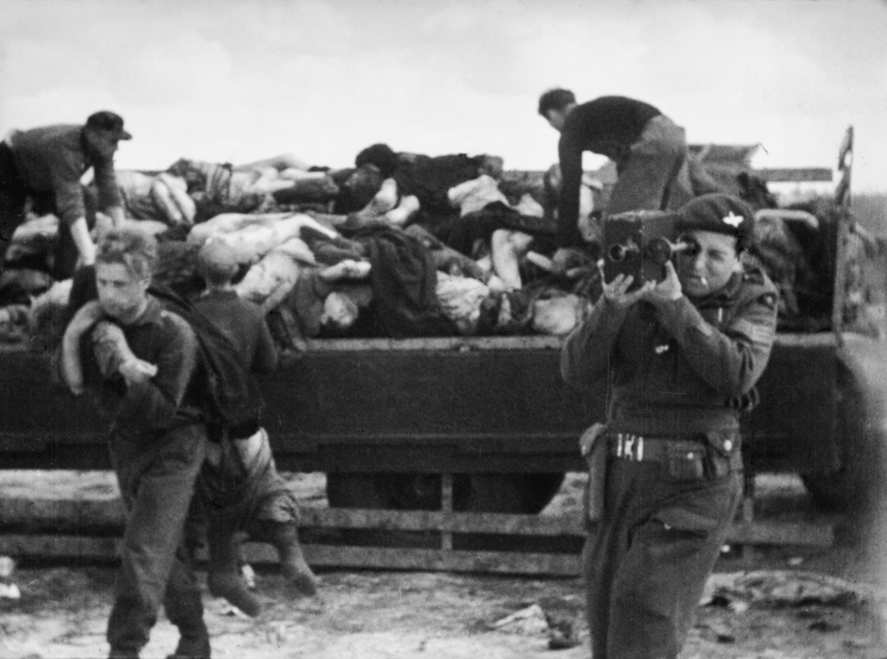 Sergeant Mike Lewis filming at Bergen-Belsen.